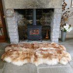 Sheepland Wolf Tipped British Sheepskin Quad Rug by Fireplace